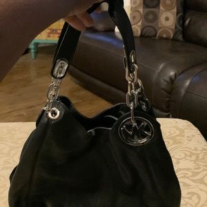 Black Micheal Kors shoulder bag it has snap compartments